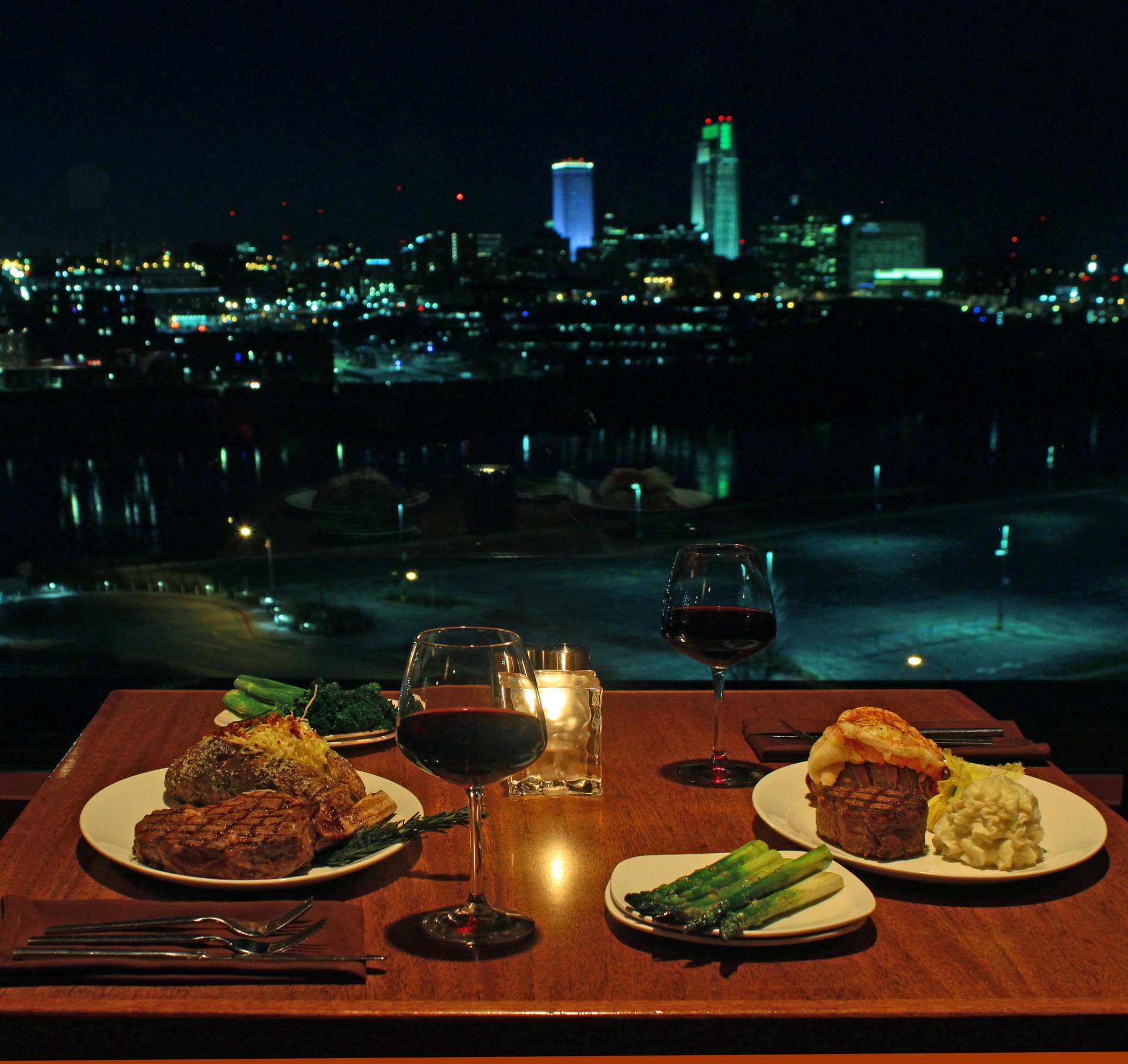 a table with steak meals