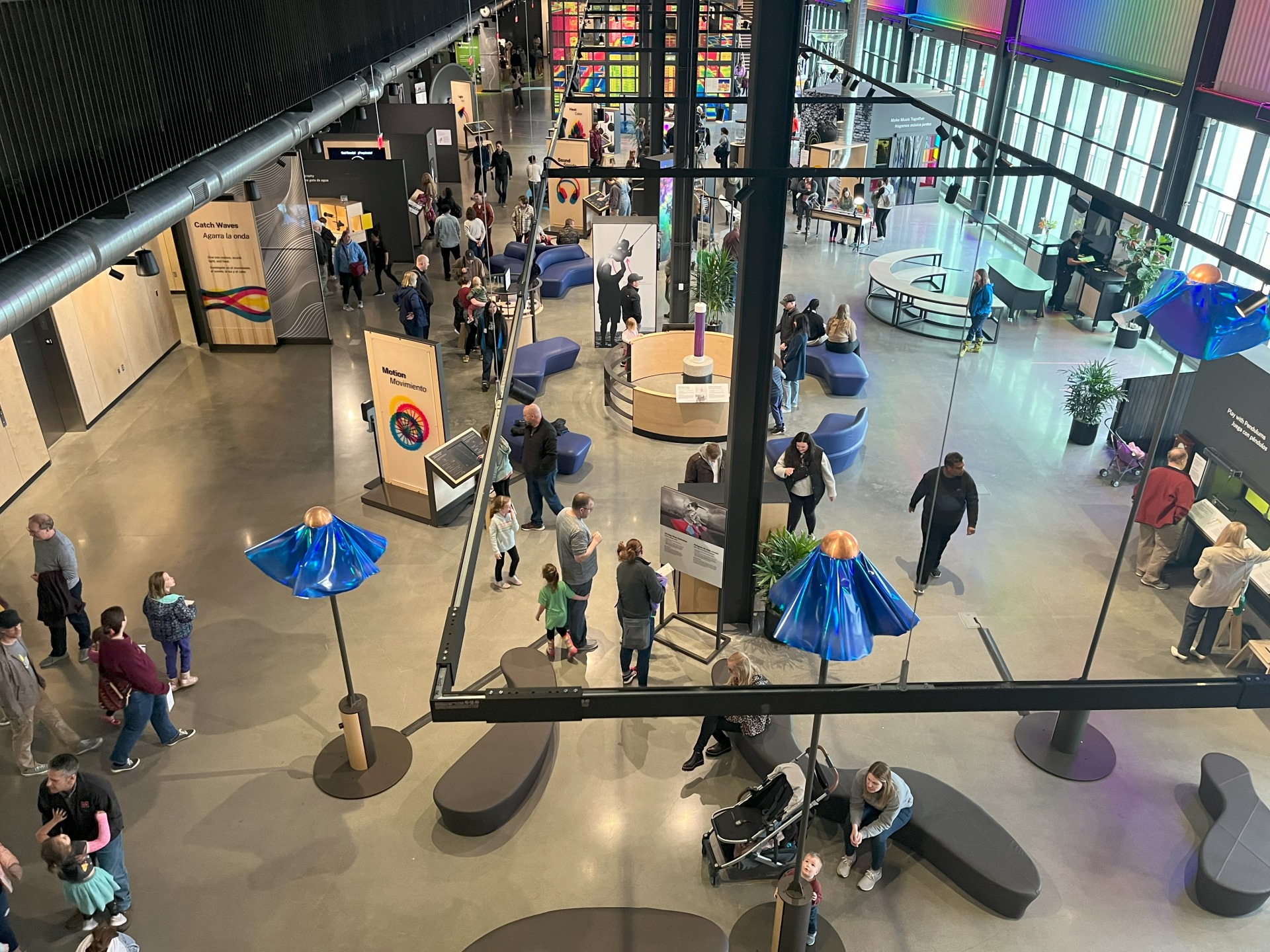 Dozens of people exploring he atrium of the Kiewitt Luminarium