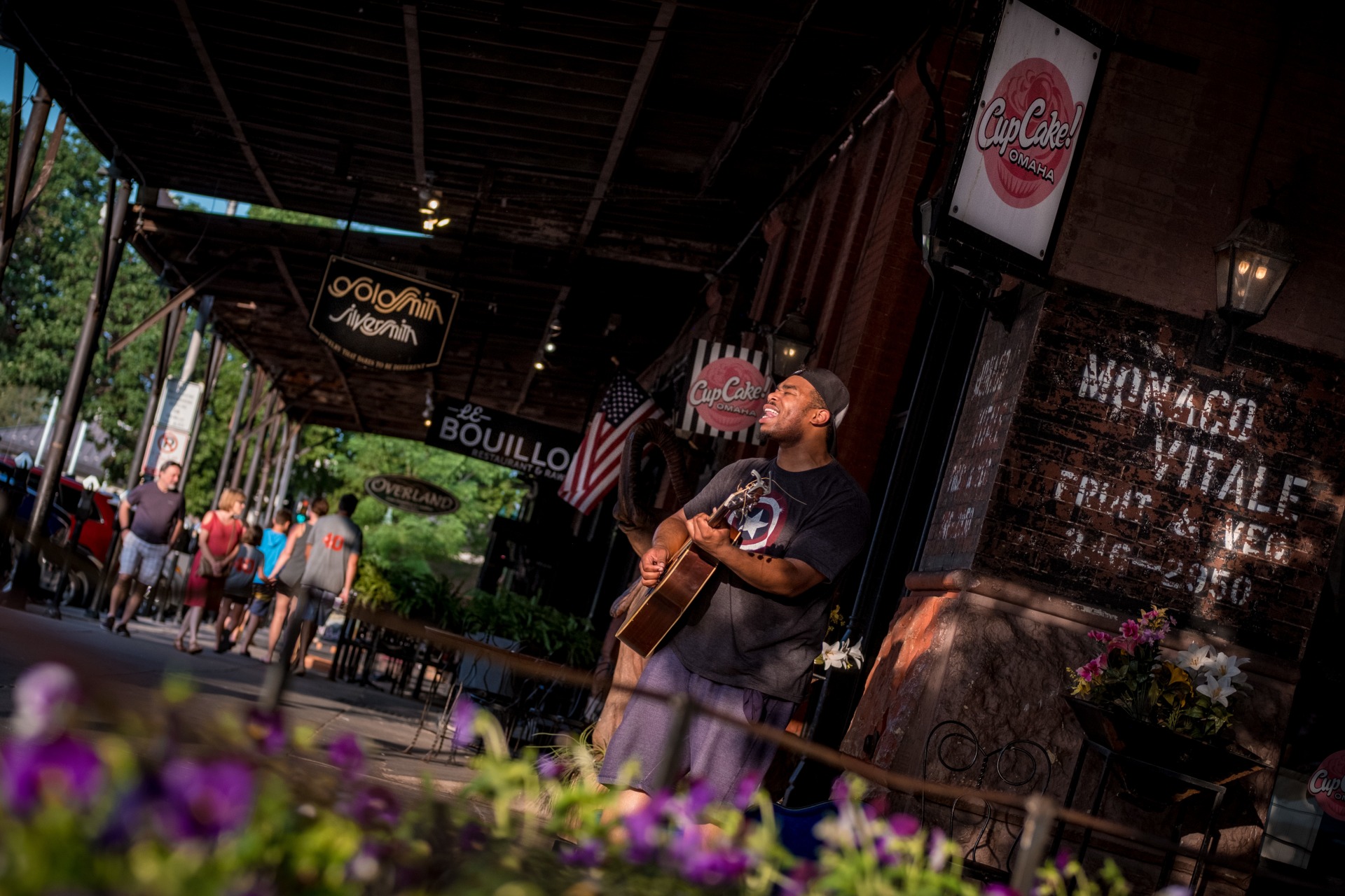 Street performer playing the guitar in the Old Market in Omaha, Nebraska.